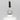 Nahaufnahme einer offenen Longlife UV-Lack Base/Top Flasche. Die Farbe ist transparent. Der UV-Nagellack tropft am Pinsel herunter.