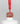 Nahaufnahme einer offenen Longlife UV-Lack Fiery Red Flasche. Die Farbe ist ein helles, knalliges Rot mit hoher Sättigung. Der UV-Nagellack tropft am Pinsel herunter.
