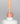 Nahaufnahme einer offenen Longlife UV-Lack Happy Day Flasche. Die Farbe ist ein helles, knalliges Orange. Der UV-Nagellack tropft am Pinsel herunter.