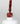 Nahaufnahme einer offenen Longlife UV-Lack Marsala Flasche. Die Farbe ist ein dunkles Rot mit Braun-Stich. Der UV-Nagellack tropft am Pinsel herunter.