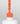 Nahaufnahme einer offenen Longlife UV-Lack Neon Coral Flasche. Die Farbe ist ein knalliges Orange mit Rot-Stich mit hoher Sättigung. Der UV-Lack tropft am Pinsel herunter.