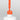 Nahaufnahme einer offenen Longlife UV-Lack Neon Coral Flasche. Die Farbe ist ein knalliges Orange mit Rot-Stich mit hoher Sättigung. Der UV-Lack tropft am Pinsel herunter.